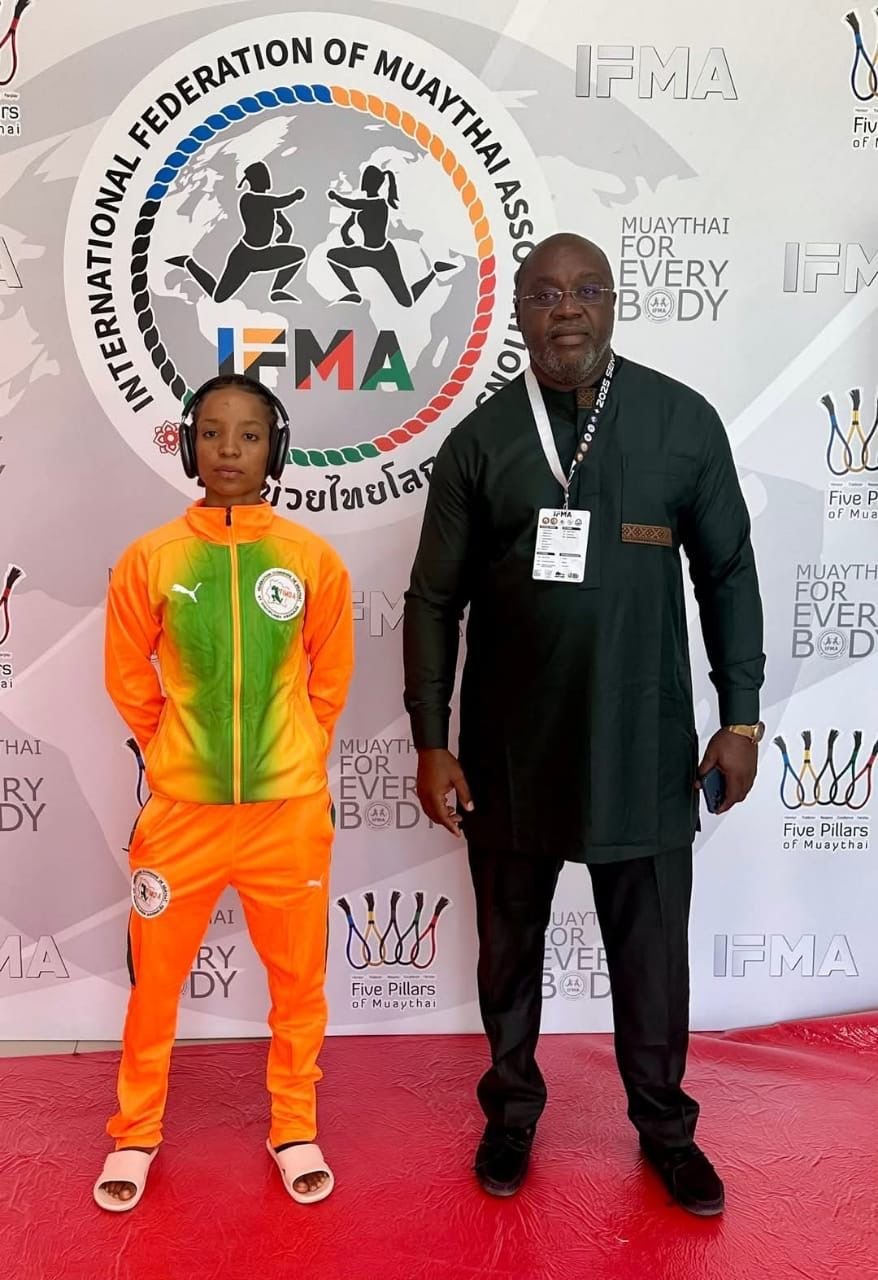 Kamaté Abi avec le président FIMDA — backdrop IFMA